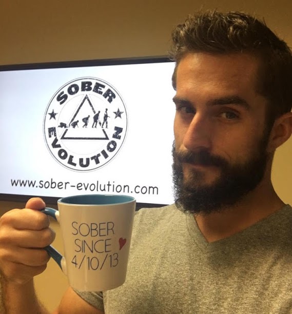 attachment-59dbb34629f1876a457d08b7 Austin Cooper of Sober Evolution holds a coffee mug that reads