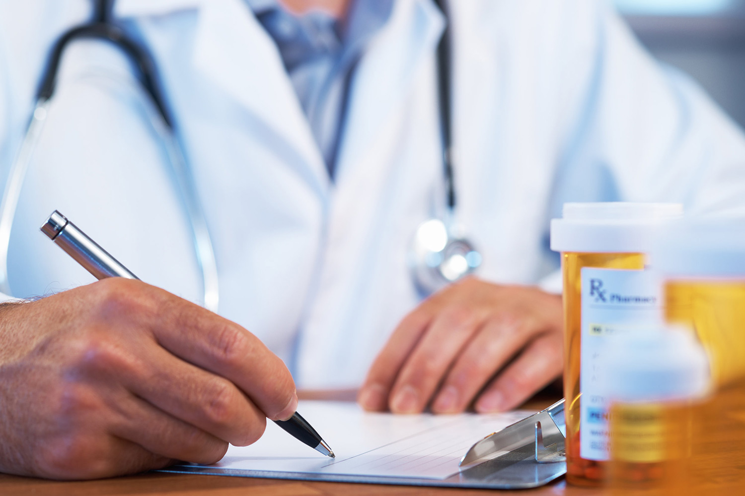 buprenorphine-overdose-day A doctor writes a prescription. Buprenorphine saves lives.